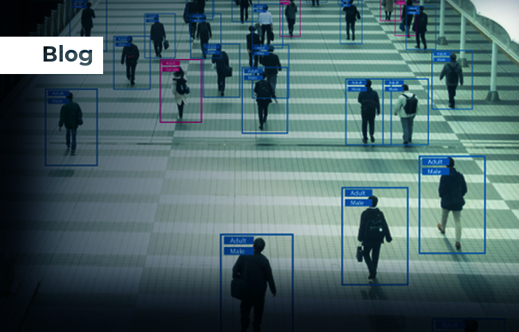 People walking in an open space with object detection boxes and labels around them, identifying their characteristics such as "Adult" and "Male."